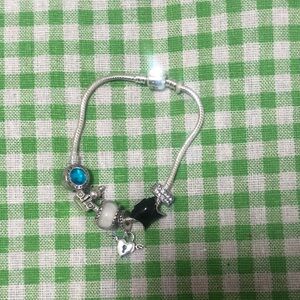 Elegant Silver Charm Bracelet with Black and Blue Accents